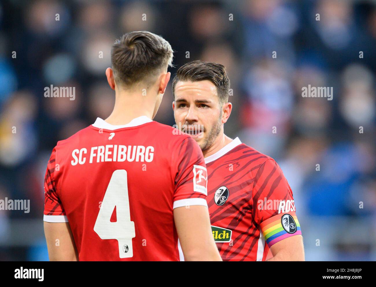 Christian GUENTER (GÃ nter, FR) in conversation with Nico SCHLOTTERBECK l. (FR), Soccer 1st Bundesliga, 13th matchday, VfL Bochum (BO) - SC Freiburg (FR) 2: 1, on November 27th, 2021 in Bochum/Germany. #DFL regulations prohibit any use of photographs as image sequences and/or quasi-video # Â Stock Photo