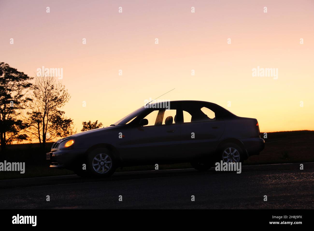Chernihiv, Ukraine - September 9, 2020: Daewoo Sens on the background of a field and sunset Stock Photo