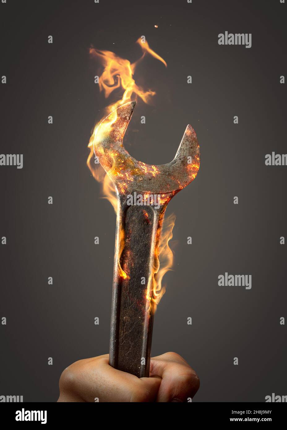 Wrench tool on fire Stock Photo Alamy
