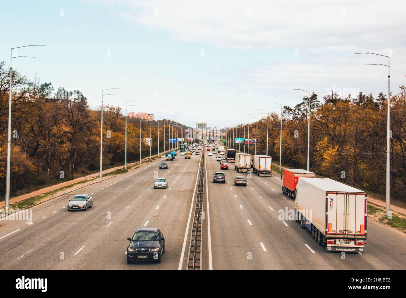 Kiev, Ukraine - April 21, 2020: Freeway. Cars are driving along the road. Two-way traffic. Stock Photo