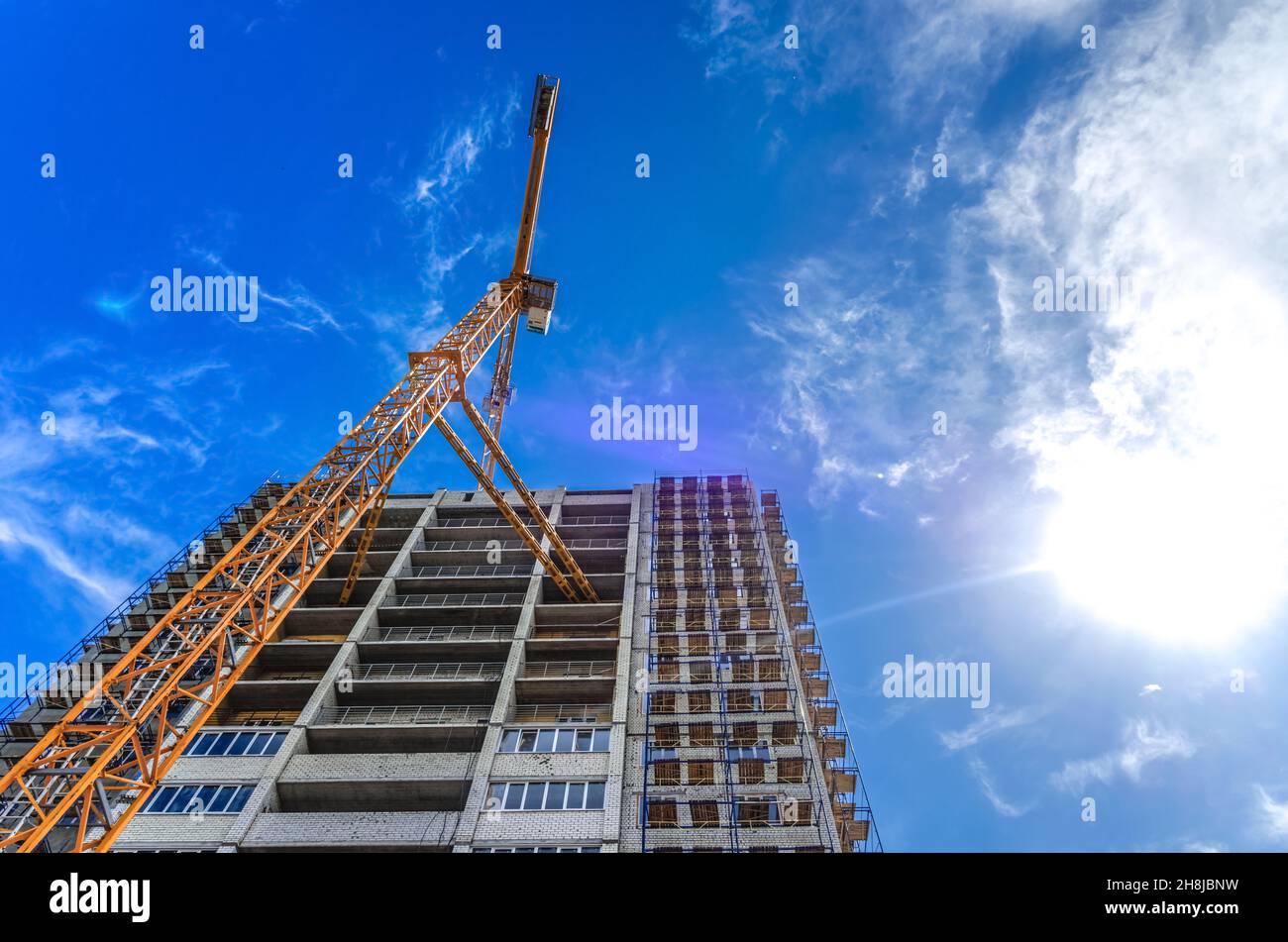 Construction of houses and crane Stock Photo