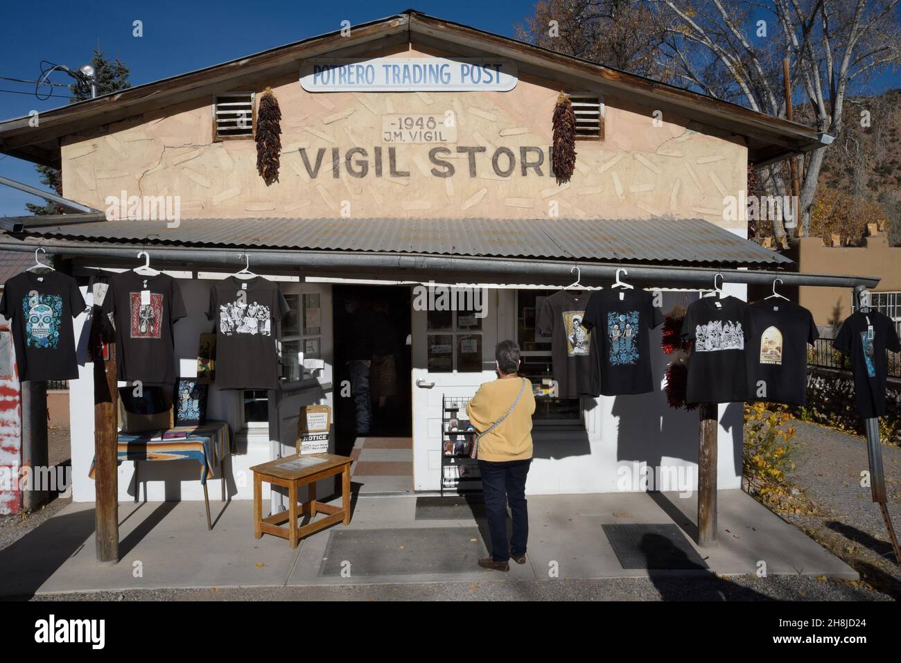 T-shirts designed by British rock musician Jon Langford for sale in a store in Chimayo, New Mexico. Langford is a founding member of the Mekons. Stock Photo