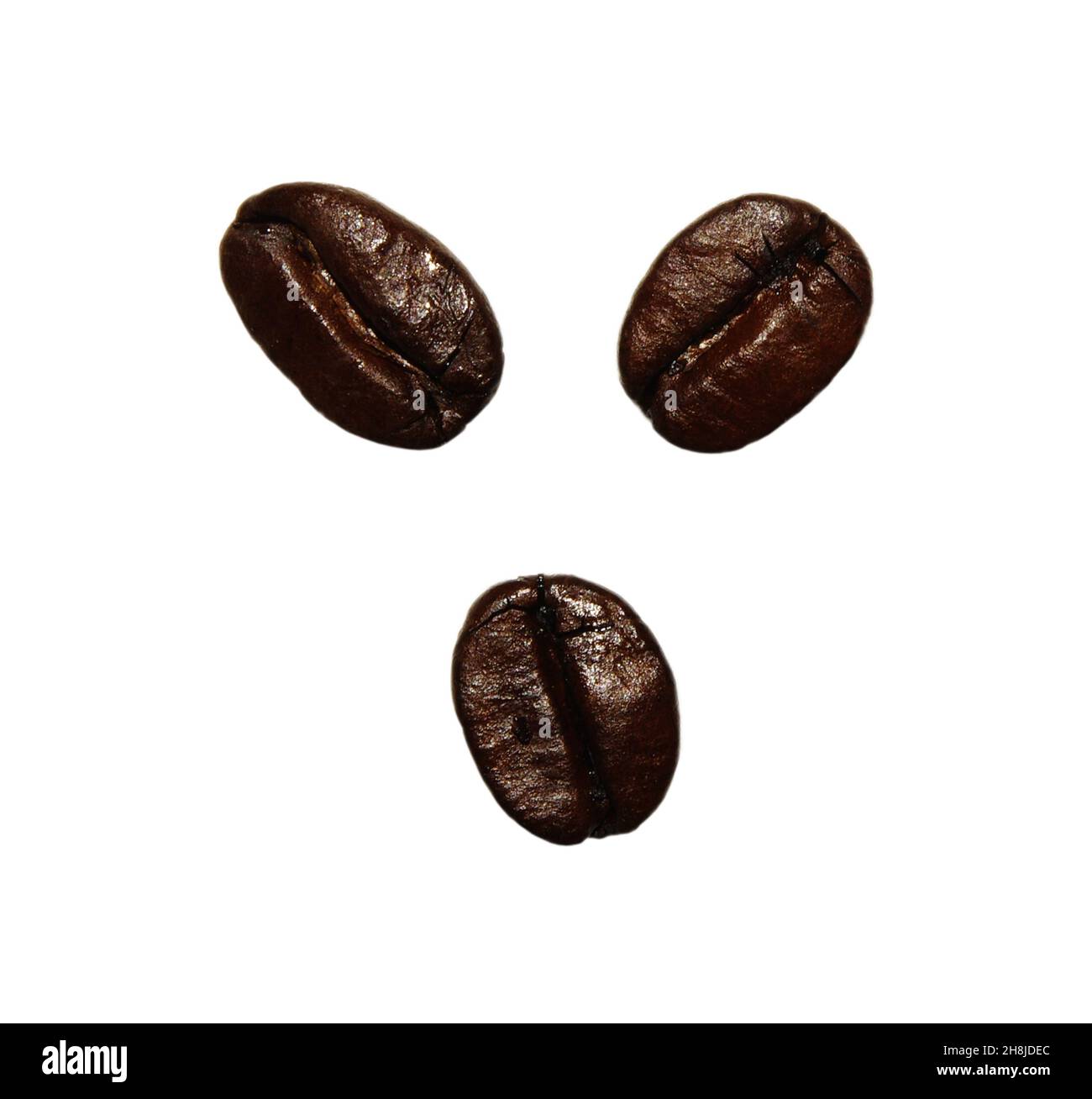 Fresh roasted coffee beans isolated on a white background. Close up of ...