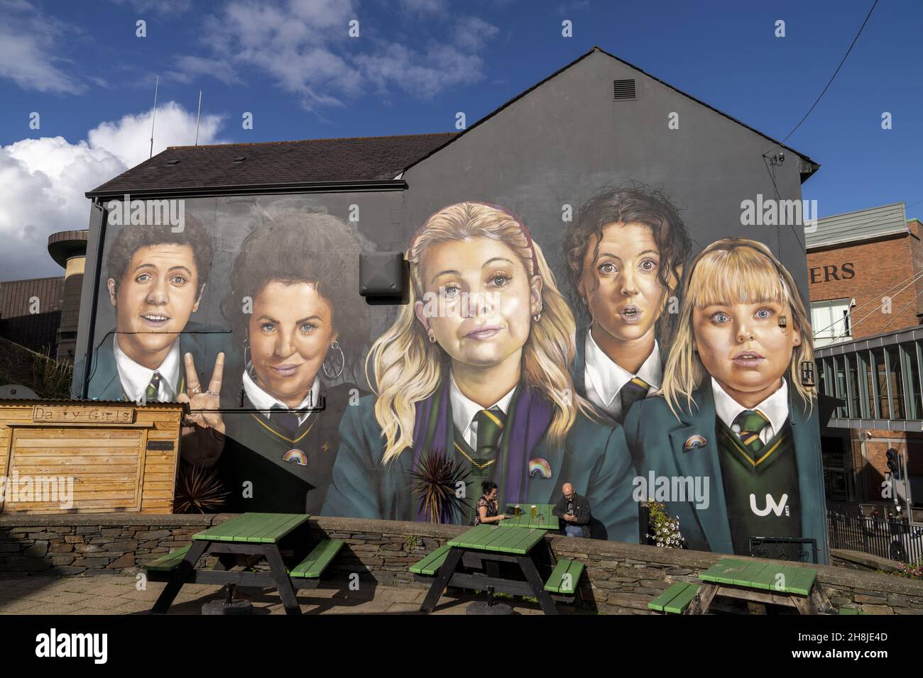 DERRY, UNITED KINGDOM - Sep 20, 2021: A famous Maiden City mural street art on a building  of Derry girls from comedy TV show  program Stock Photo