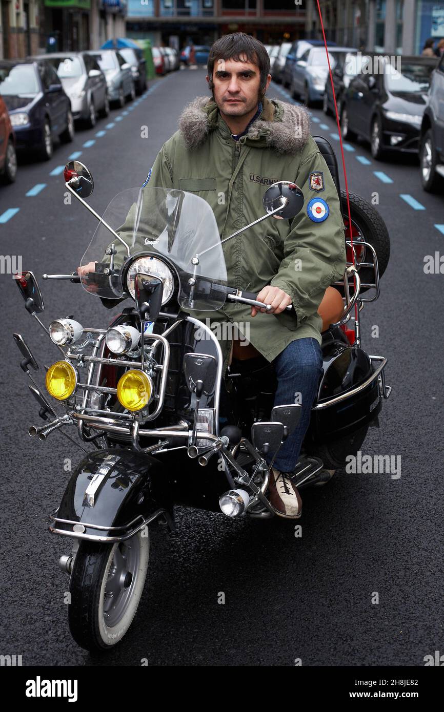 Mod Vespa scooter motorbike covered in headlights and mirrors, Stock Photo