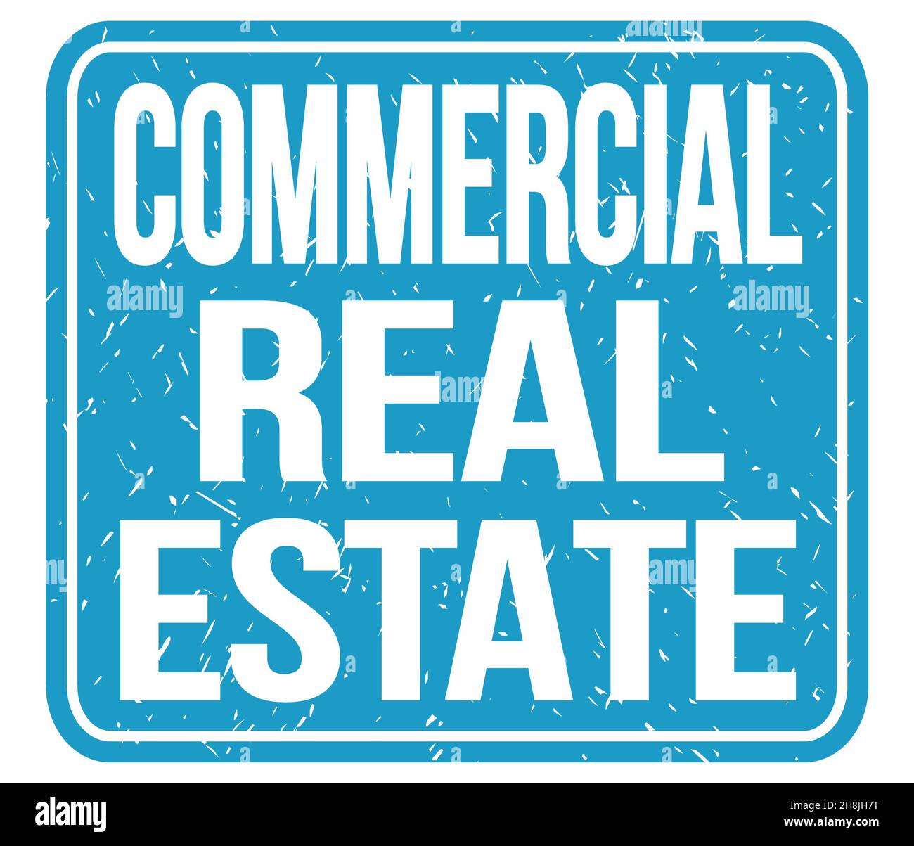 COMMERCIAL REAL ESTATE, text written on blue stamp sign Stock Photo