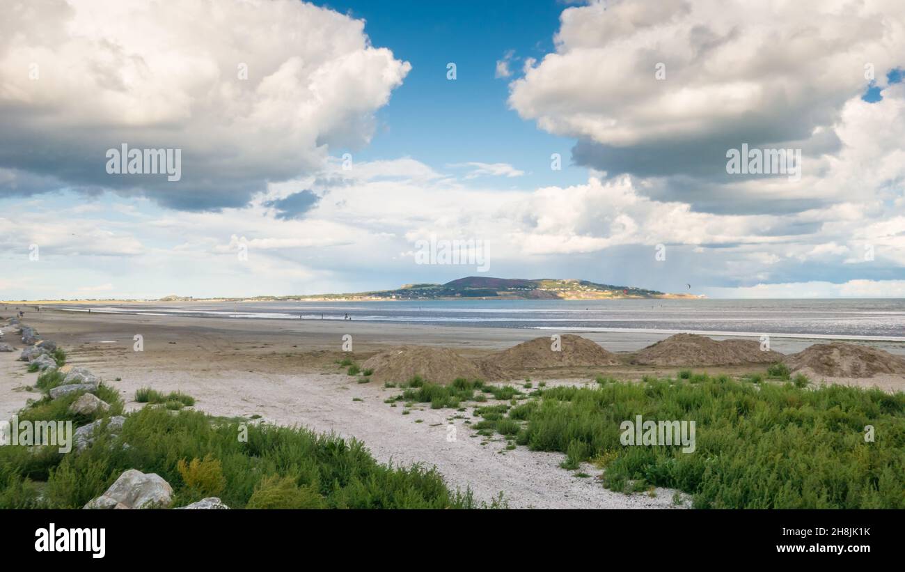 A view of Dollymount Strand, County Dublin, Ireland. Howth Head peninsula can be seen in the distance. Stock Photo