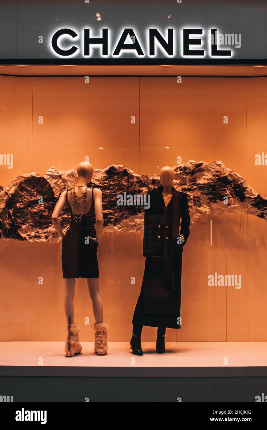 Chanel luxury shop in Moscow. Two mannequins dressed in elegant black dresses. Chanel is a fashion house founded in 1909 specialized in haute couture Stock Photo