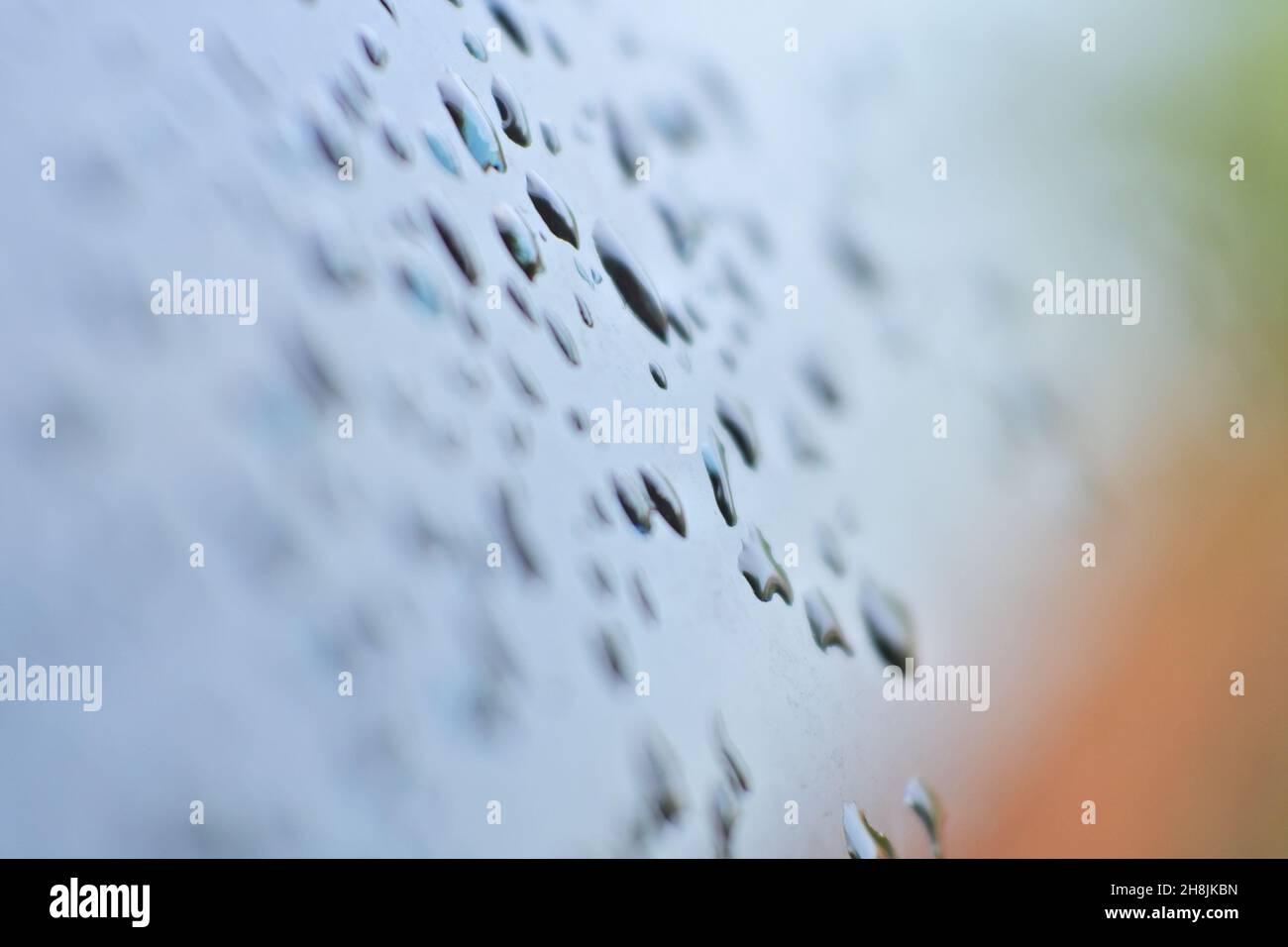 Macro shot of water drops in a blurred background Stock Photo - Alamy
