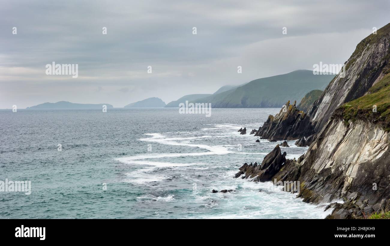 View from Slea Head, Dunquin on the Dingle Peninsula in west County Kerry, Ireland. The Blasket Islands can be seen in the distance. Stock Photo