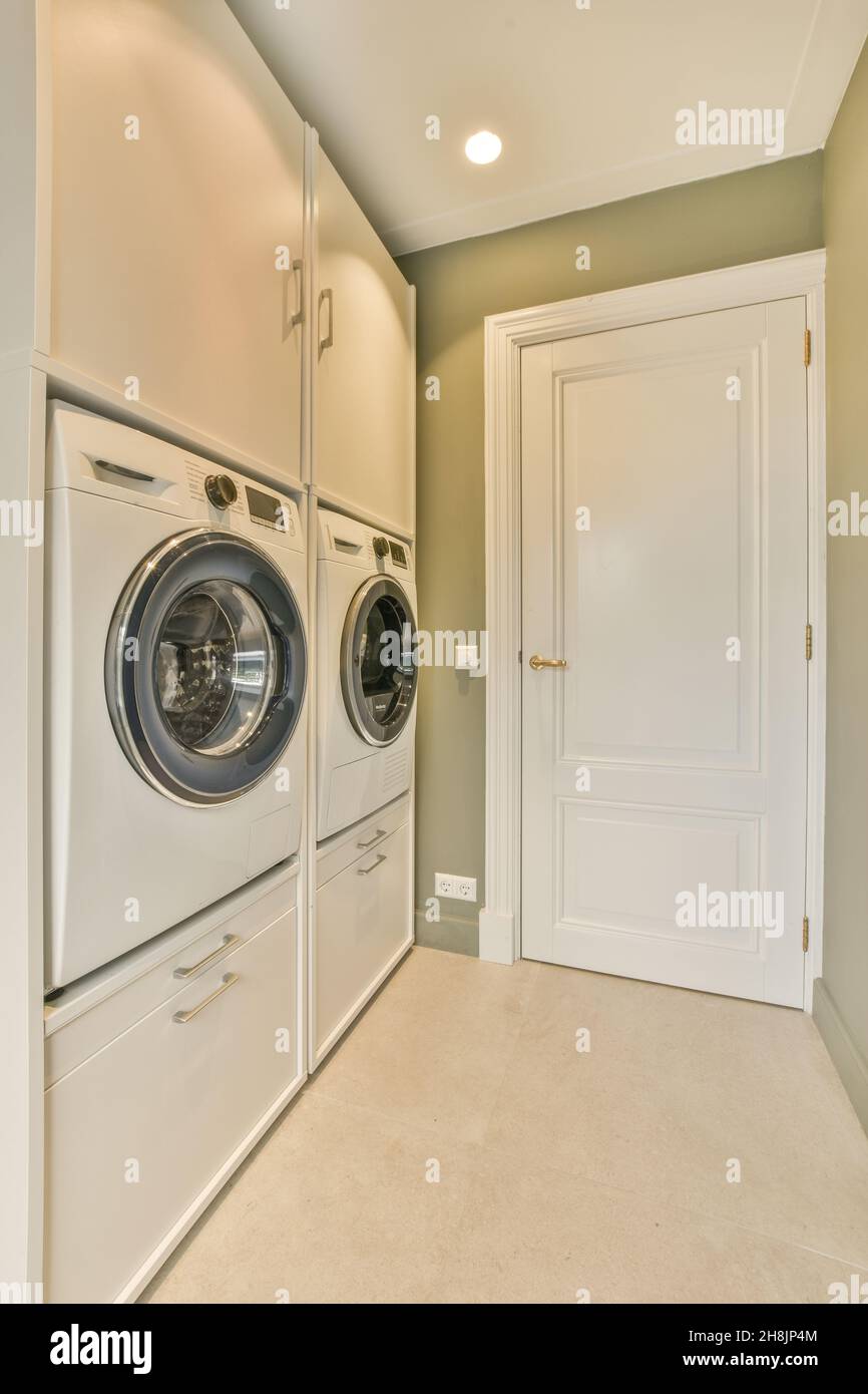 Cozy small room with a washing machines in an apartment Stock Photo