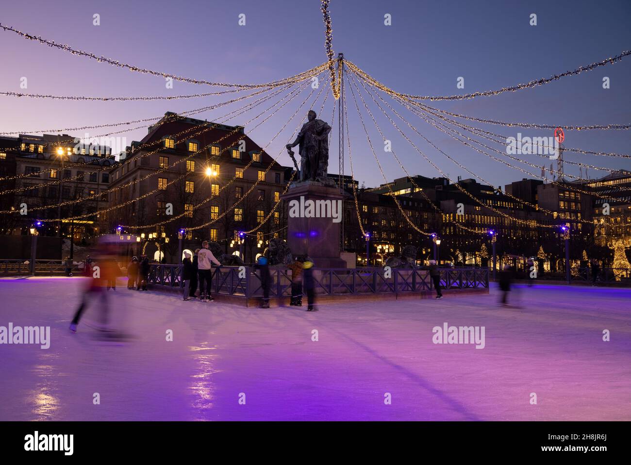 Winter in Stockholm. Ice skating in the square in Kungstradgarden