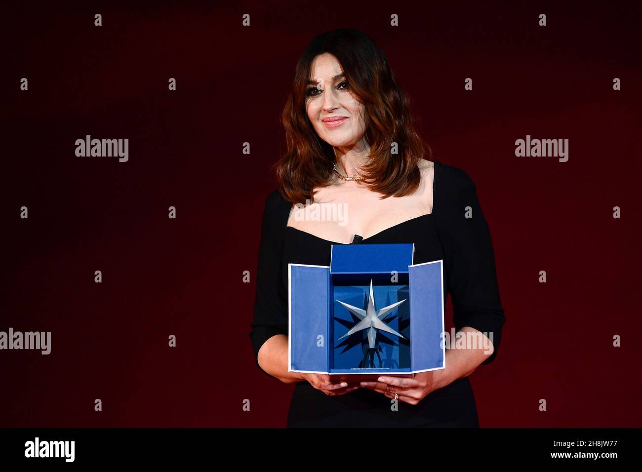 Turin, Italy. 30 November 2021. Monica Bellucci holds the award during a ceremony to celebrate the actress with the Stella della Mole Award ('Star of Mole') for artistic innovation. Credit: Nicolò Campo/Alamy Live News Stock Photo