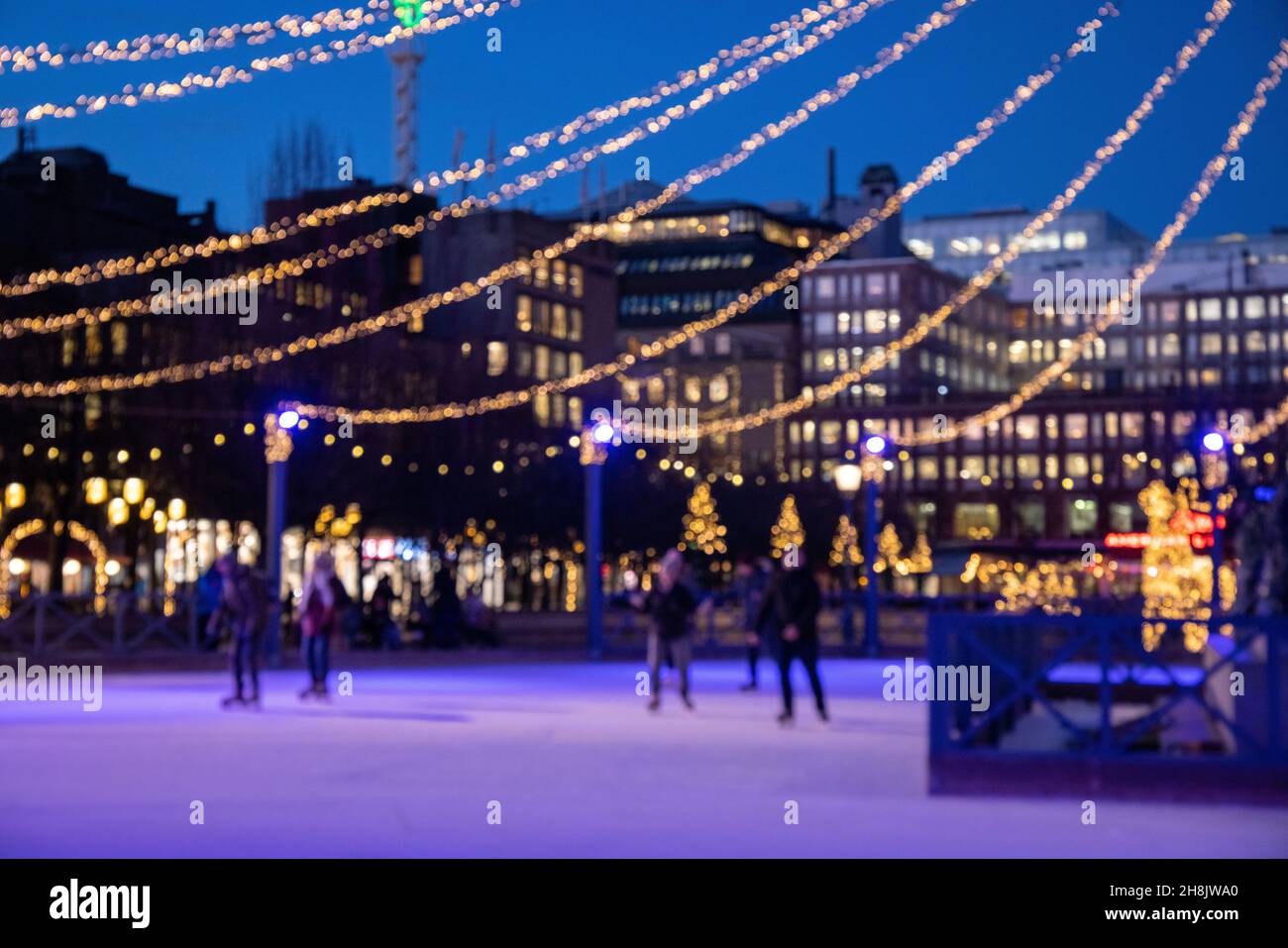 Winter in Stockholm. Ice skating in the square in Kungstradgarden