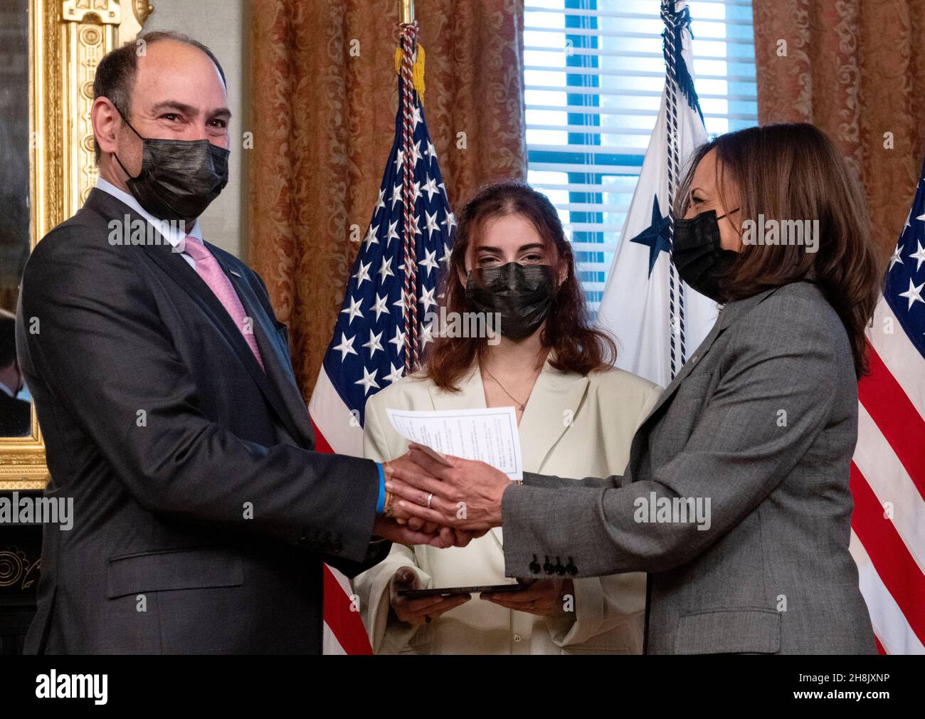 United States Vice President Kamala Harris, right, shakes hands with