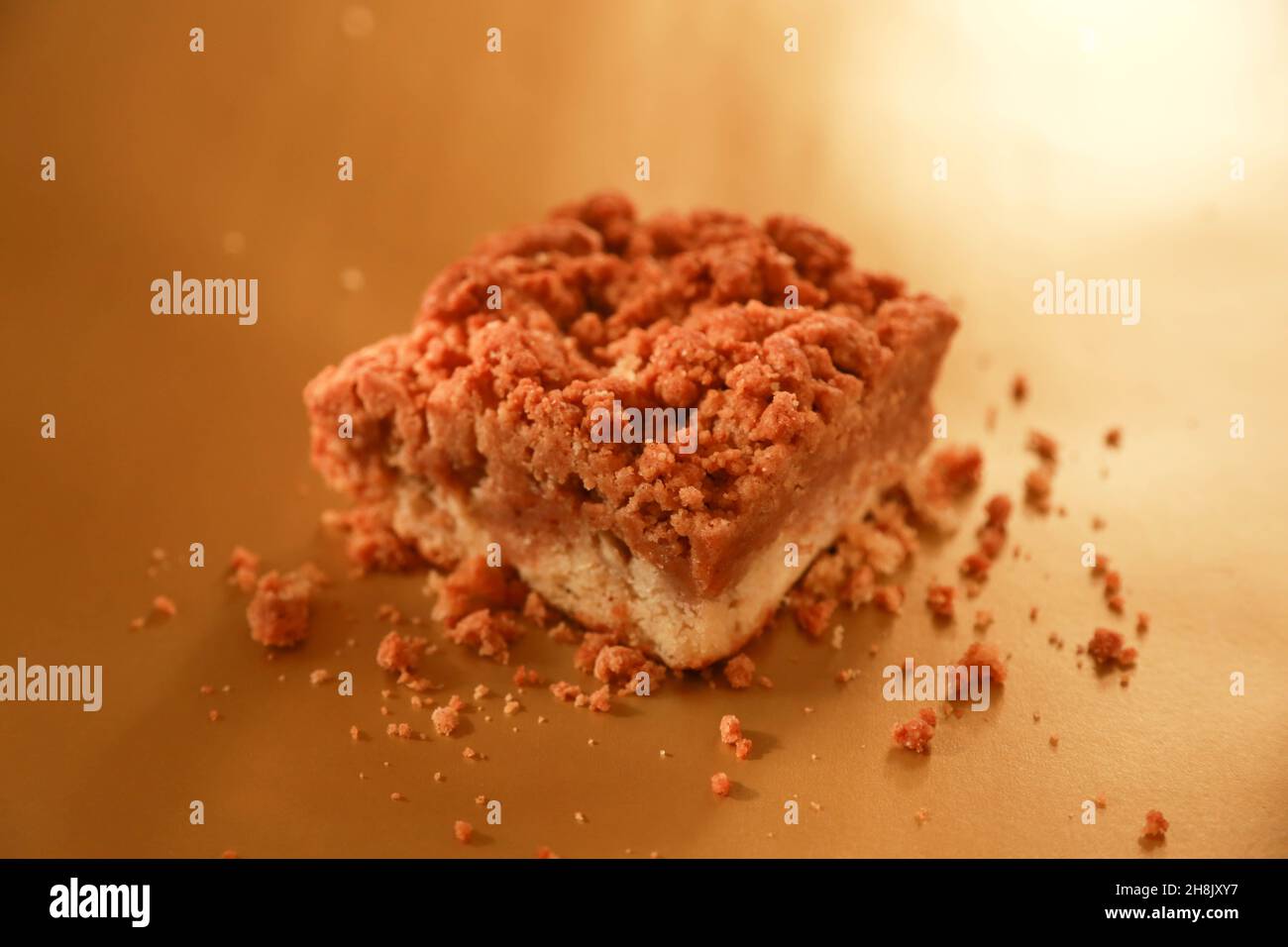 Single Brownie on shiny gold background in studio photograph Stock Photo