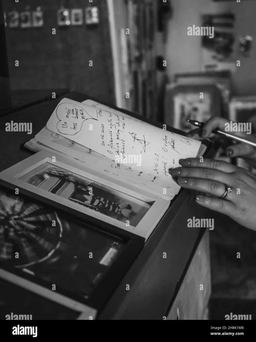 Black hand writing book Black and White Stock Photos & Images - Alamy