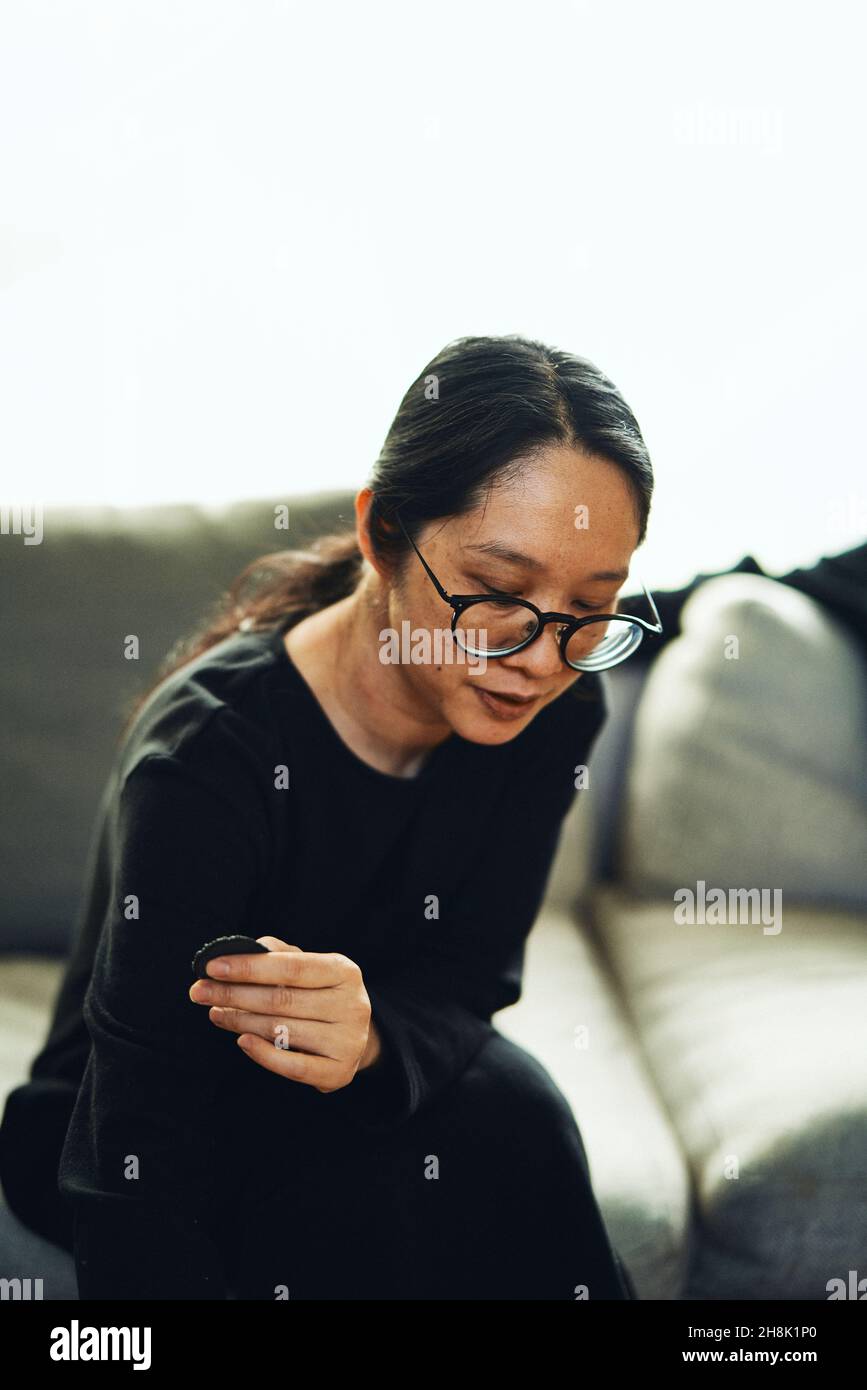 Young woman long hair black glasses hi-res stock photography and images -  Alamy