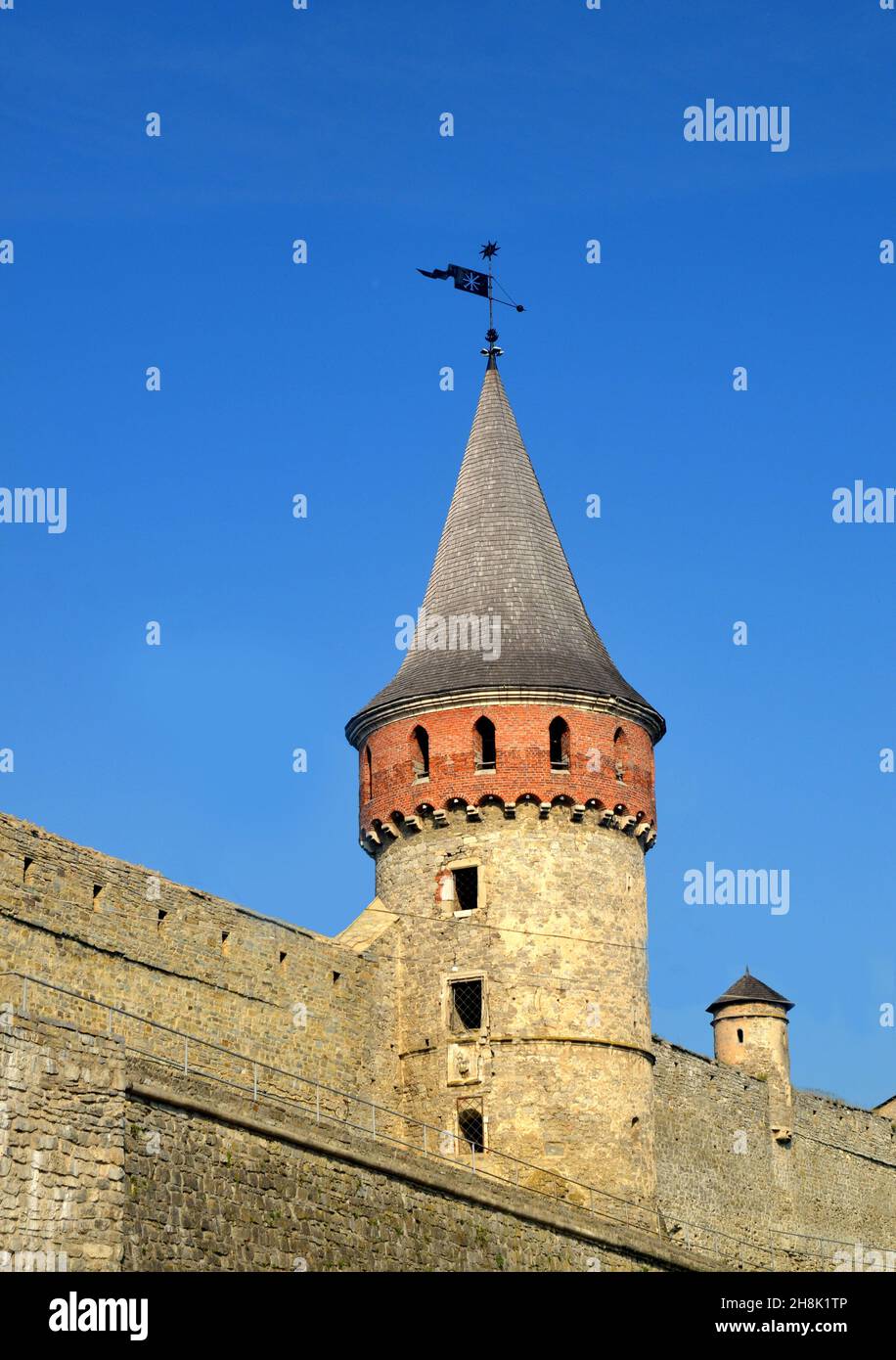 Old brick wall and tower of the Kamianets-Podilskyi Castle (XIV century)  in Ukraine. Medieval fortification Stock Photo