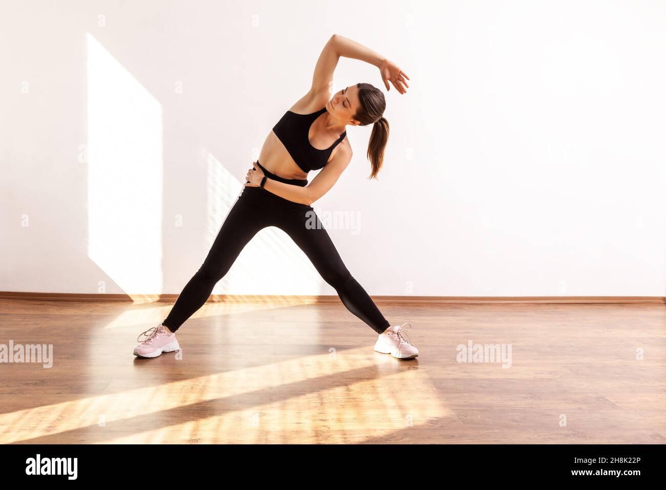 Standing Side Stretch Pose In Yoga Class Stock Photo - Download Image Now -  2015, Adult, Adults Only - iStock