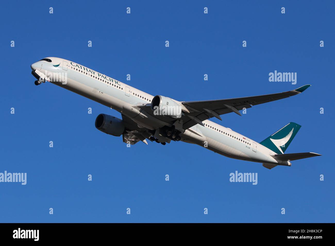 An Airbus A350 operated by Cathay Pacific departs from London Heathrow Airport Stock Photo