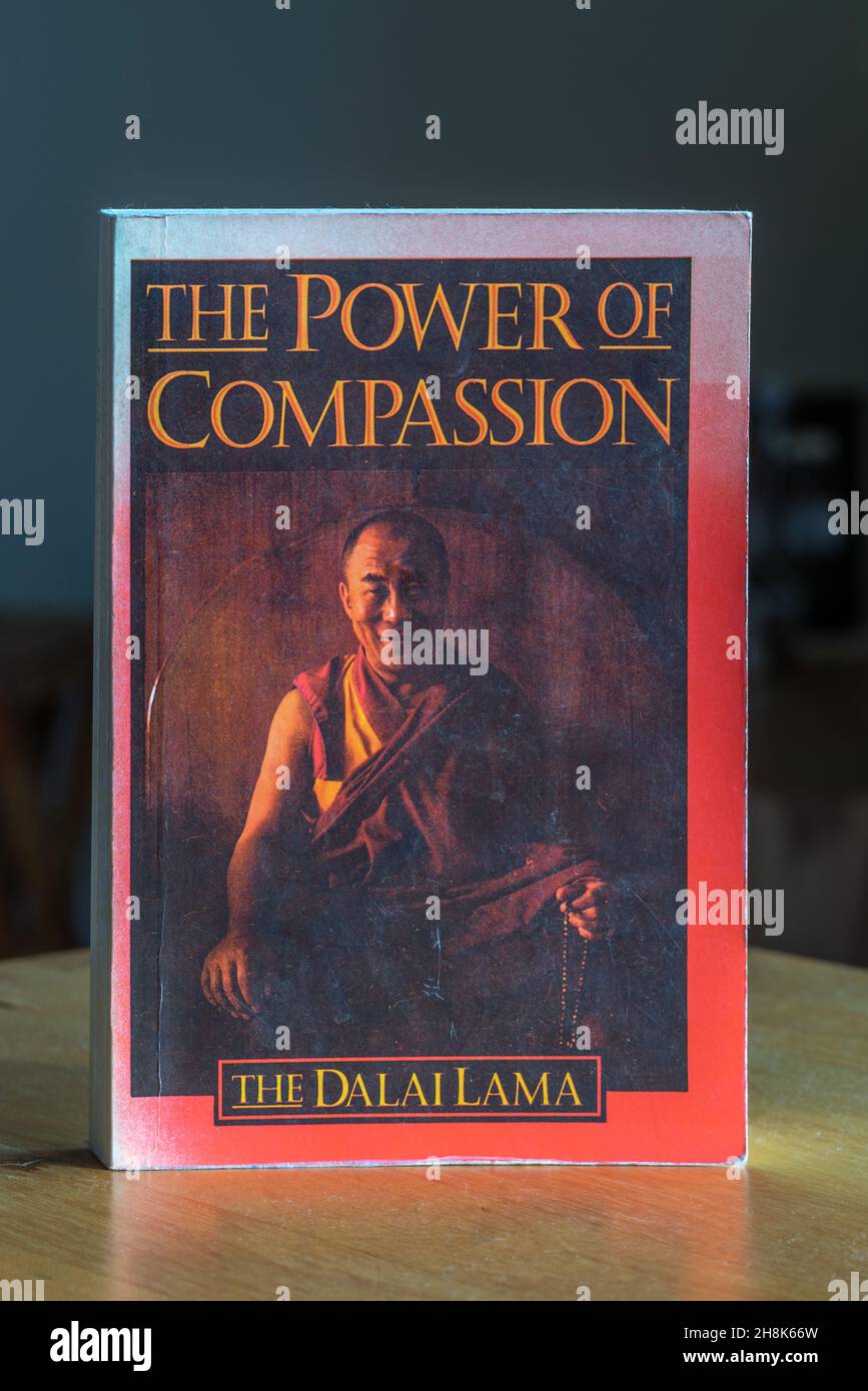 An old English copy of the 'Power of Compassion' book by the Dalai Lama Stock Photo