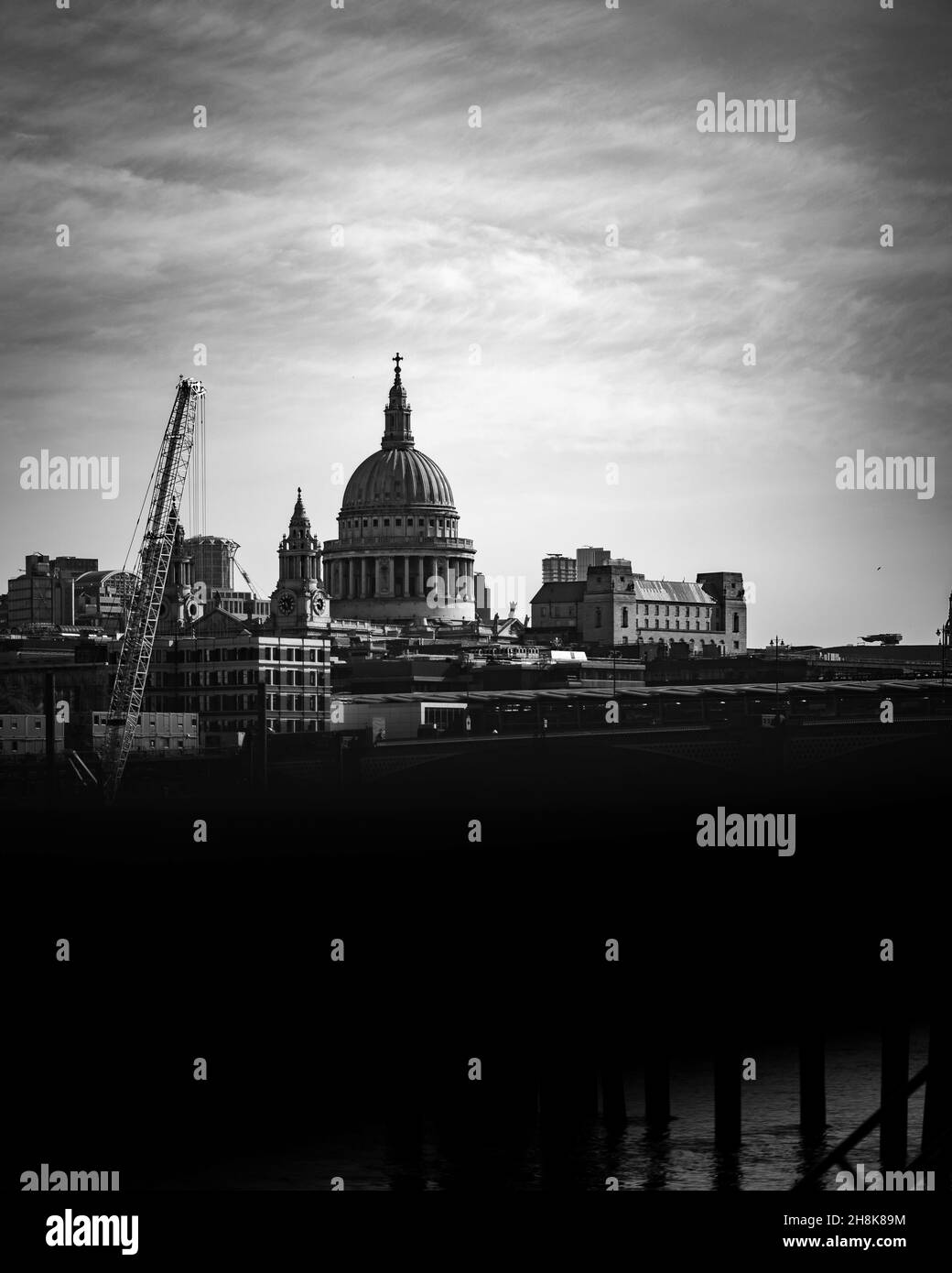 Grayscale view of st paul cathedral, London, united kingdom against a light cloudy sky Stock Photo