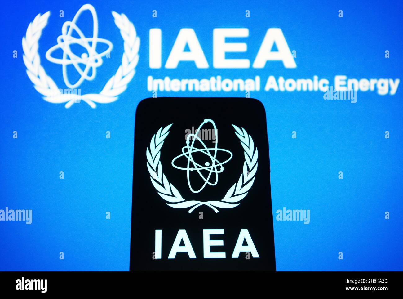 In this photo illustration, International Atomic Energy Agency (IAEA) logo  is seen displayed on a smartphone and a pc screen. (Photo by Pavlo Gonchar  / SOPA Images/Sipa USA Stock Photo - Alamy, image size:1300x964