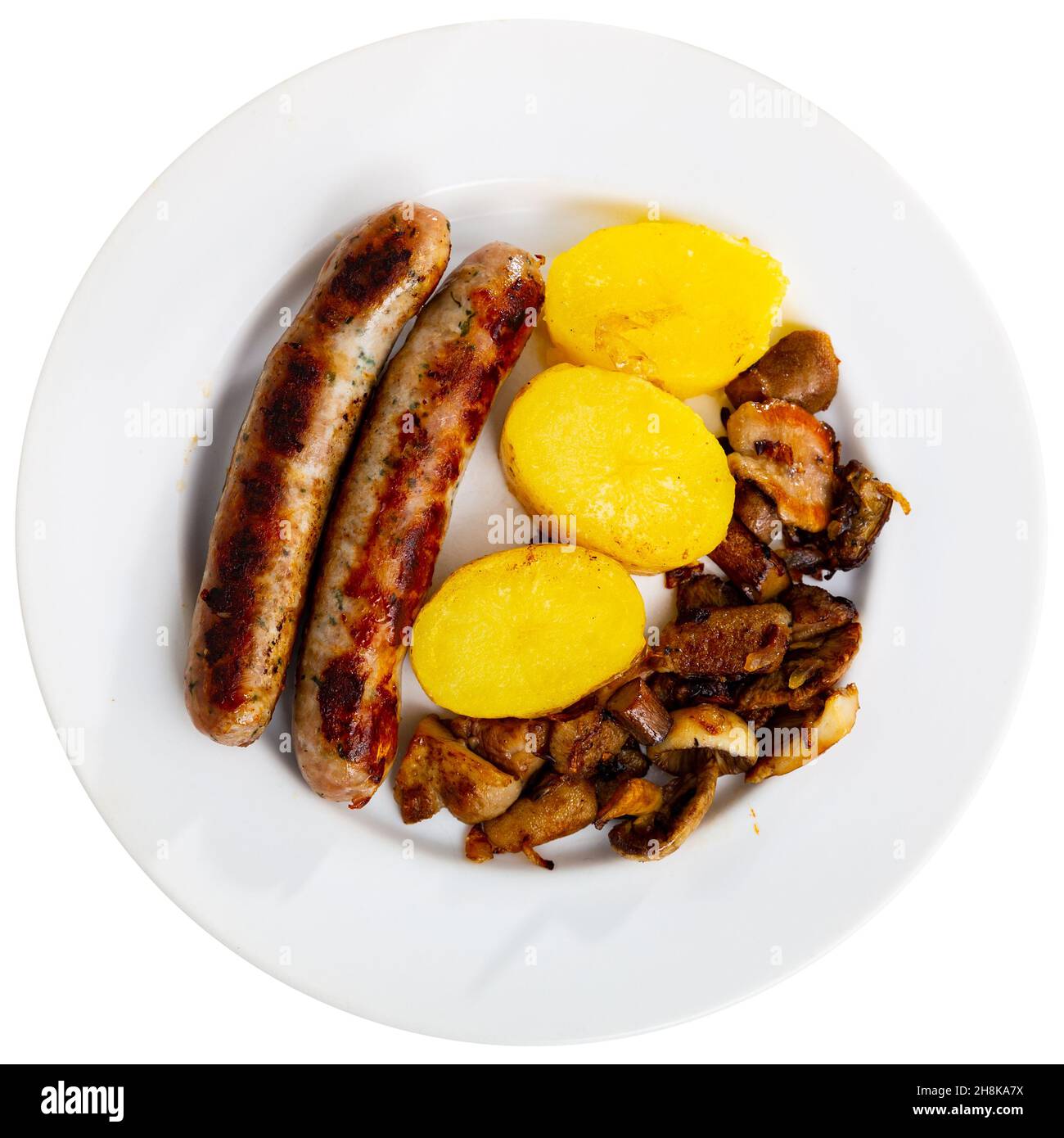 Popular dish made from sausages with mushrooms and potatoes Stock Photo
