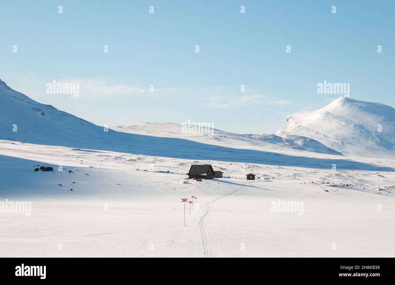An emergency hut along Kungsleden trail between Salka and Kebnekaise covered in snow, early April 2021 Stock Photo