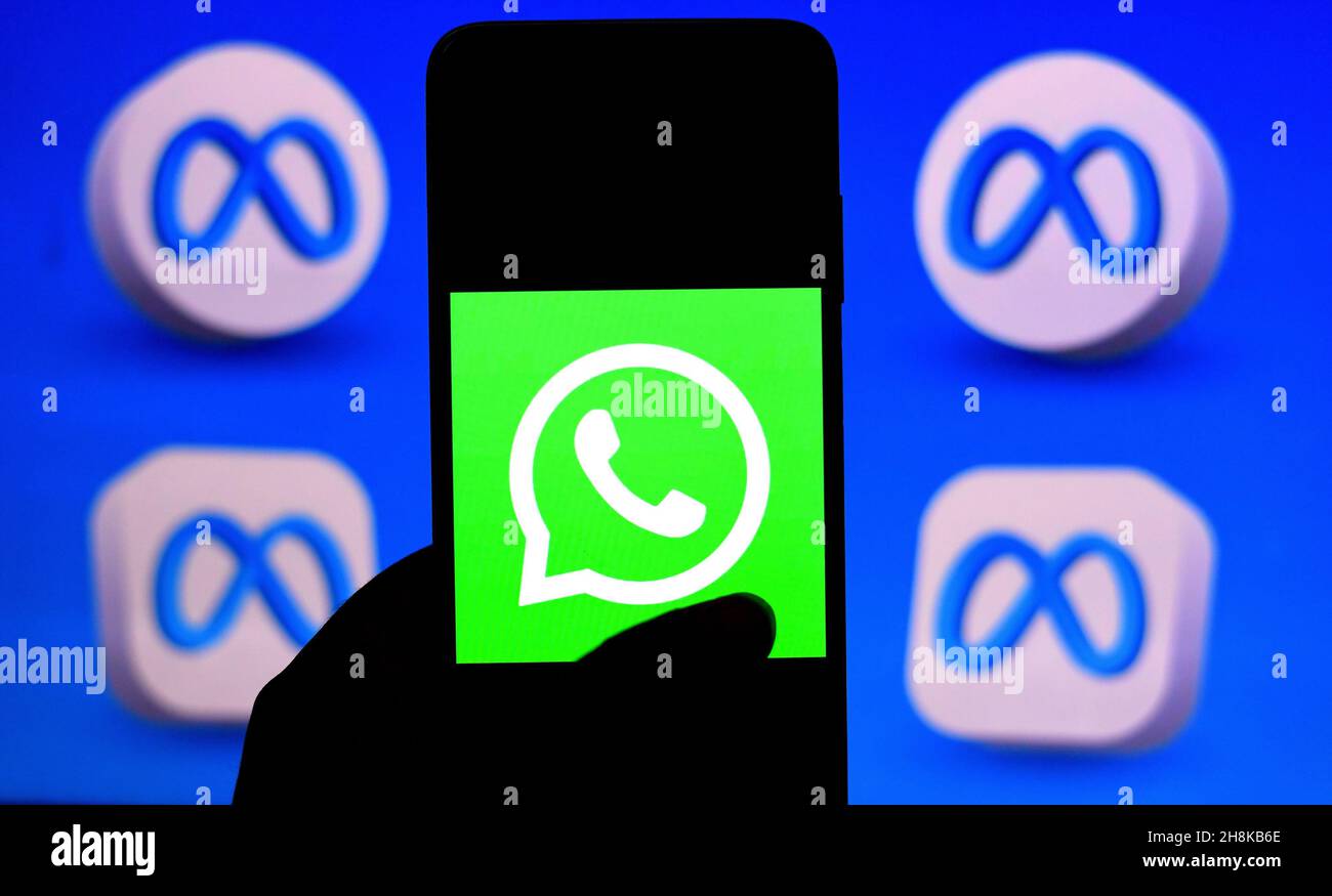 India. 30th Nov, 2021. In this photo illustration, a Whatsapp logo seen displayed on a smartphone with metaverse logos in background. (Photo by Avishek Das/SOPA Images/Sipa USA) Credit: Sipa USA/Alamy Live News Stock Photo