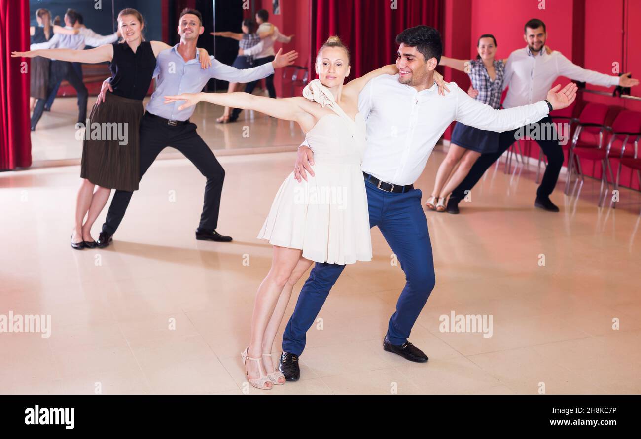 Smiling people practicing passionate samba Stock Photo