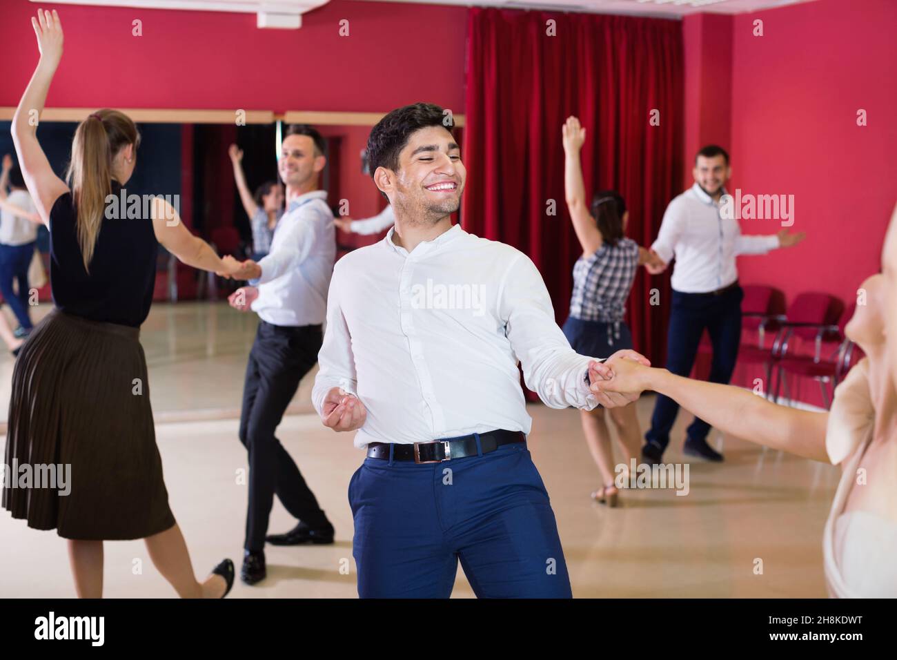 People practicing passionate samba in dance class Stock Photo