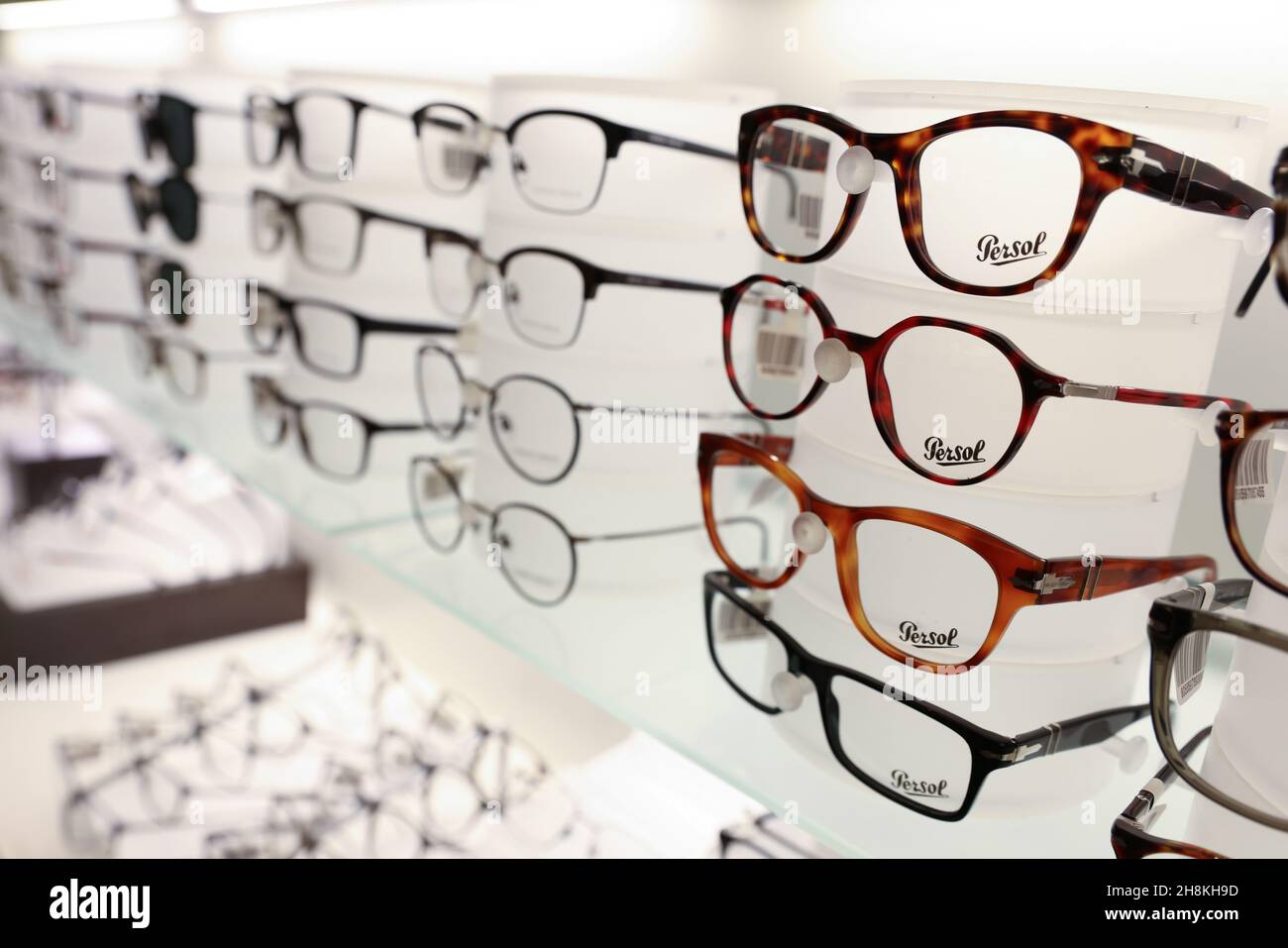 Persol glasses are pictured for sale in a LensCrafters, both brands