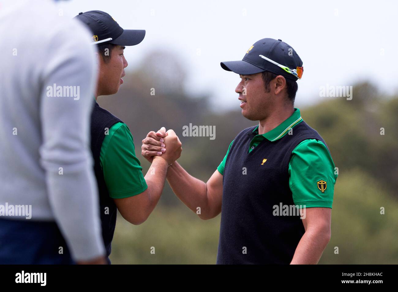 Hideki Matsuyama of Japan celebrates with teammate Beyond Hun An of South Korea during round 2 of The Presidents Cup Credit: Speed Media/Alamy Live News Stock Photo