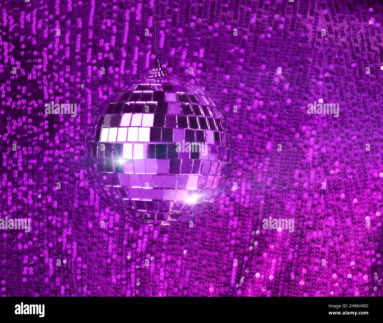 disco balls for decorationof a party on pink background Stock Photo - Alamy