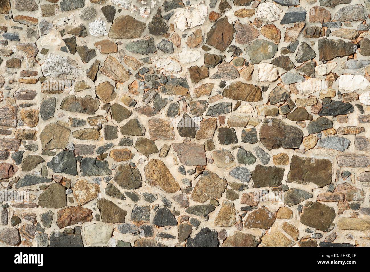 Close Up texture of stones placed with cement. Salvador, Bahia, Brazil. Stock Photo