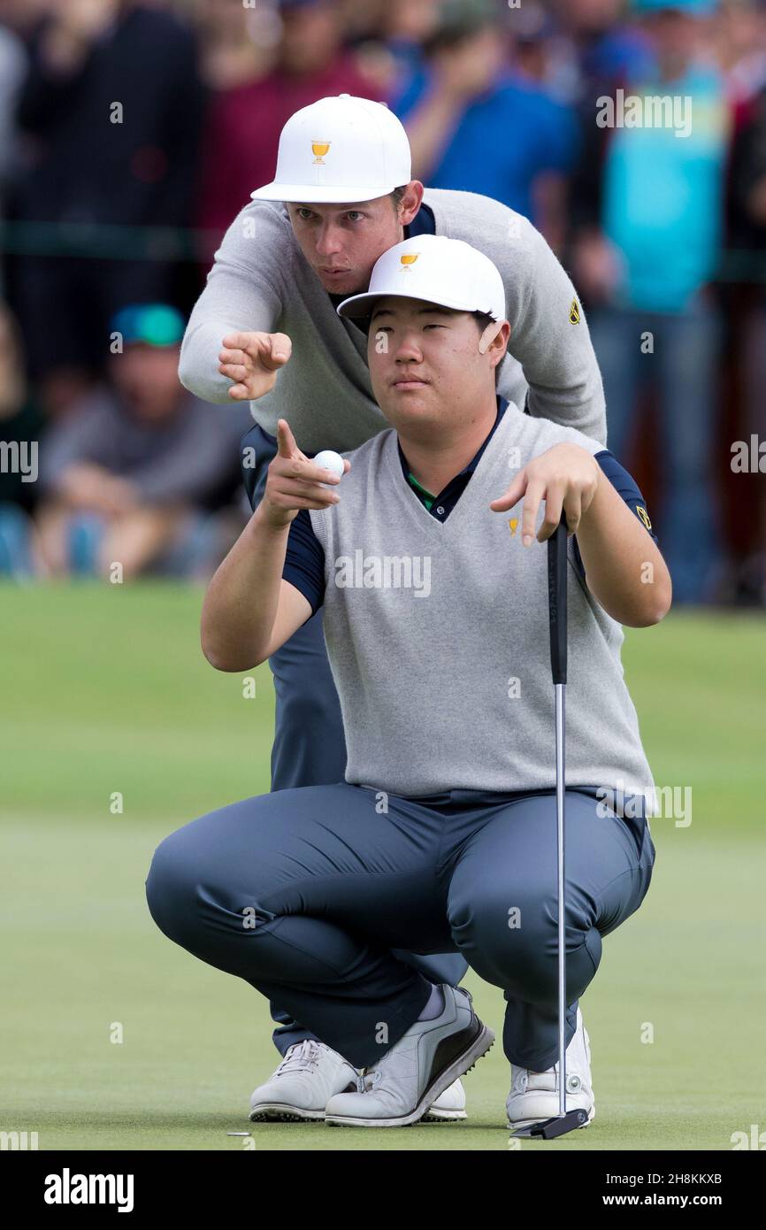 Cameron Smith of Australia and Sungjae Im of South Korea line up a putt during round 3 of The Presidents Cup Credit Speed Media/Alamy Live News Stock Photo