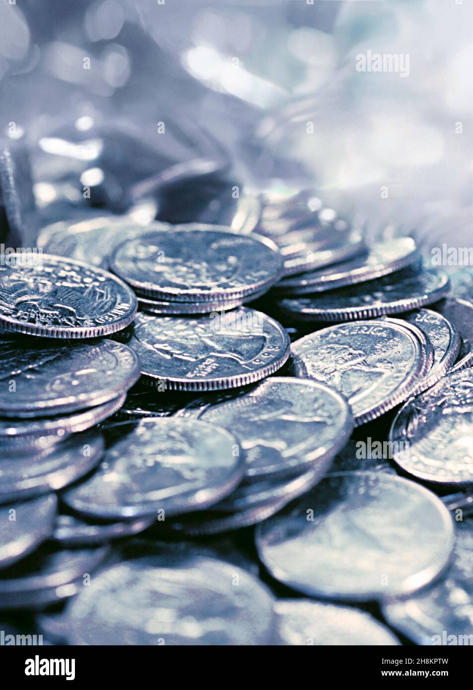 Silver coins. Pile of silver coins.Saving money. American quarters in a pile. Small change. Savings for a rainy day. Still life Stock Photo