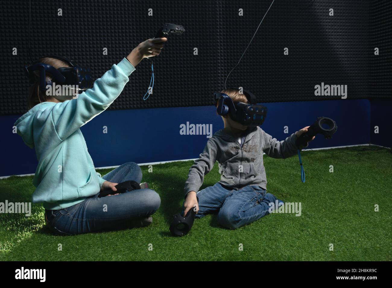 two children enjoying VR technology, boy and girl wearing virtual
