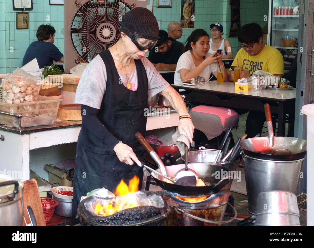 Jay Fai became Bangkok's first street food stall to be awarded a Michelin star in 2018. Revered by local and foreign foodies is also Supinya Junsuta. Stock Photo