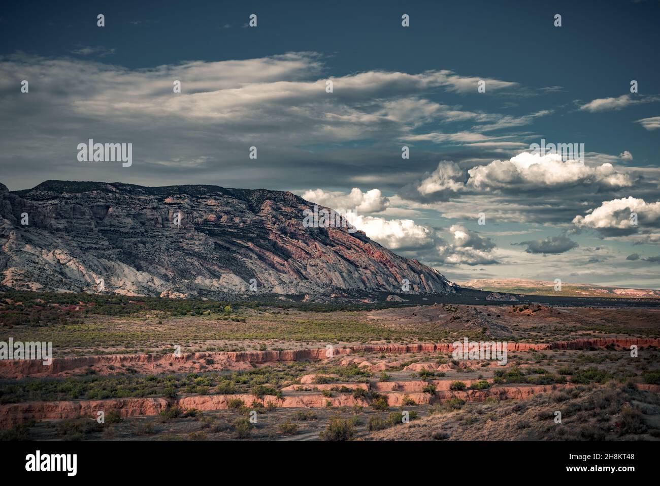 The beautiful view cloudy sky, red and green canyon in Colorado. The incredibly colorful background Stock Photo