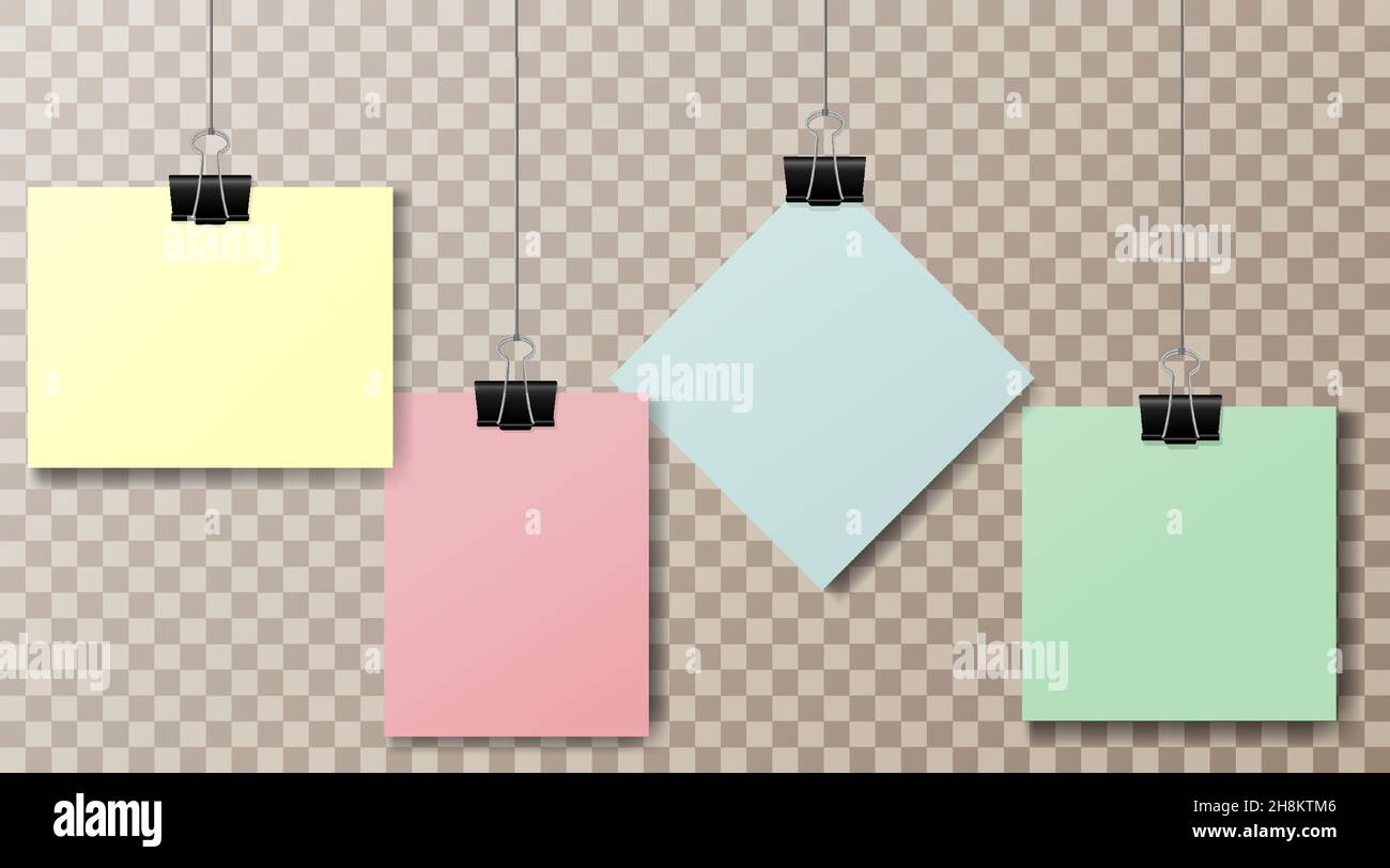 A set of multicolored pieces of paper and office clips on a transparent ...
