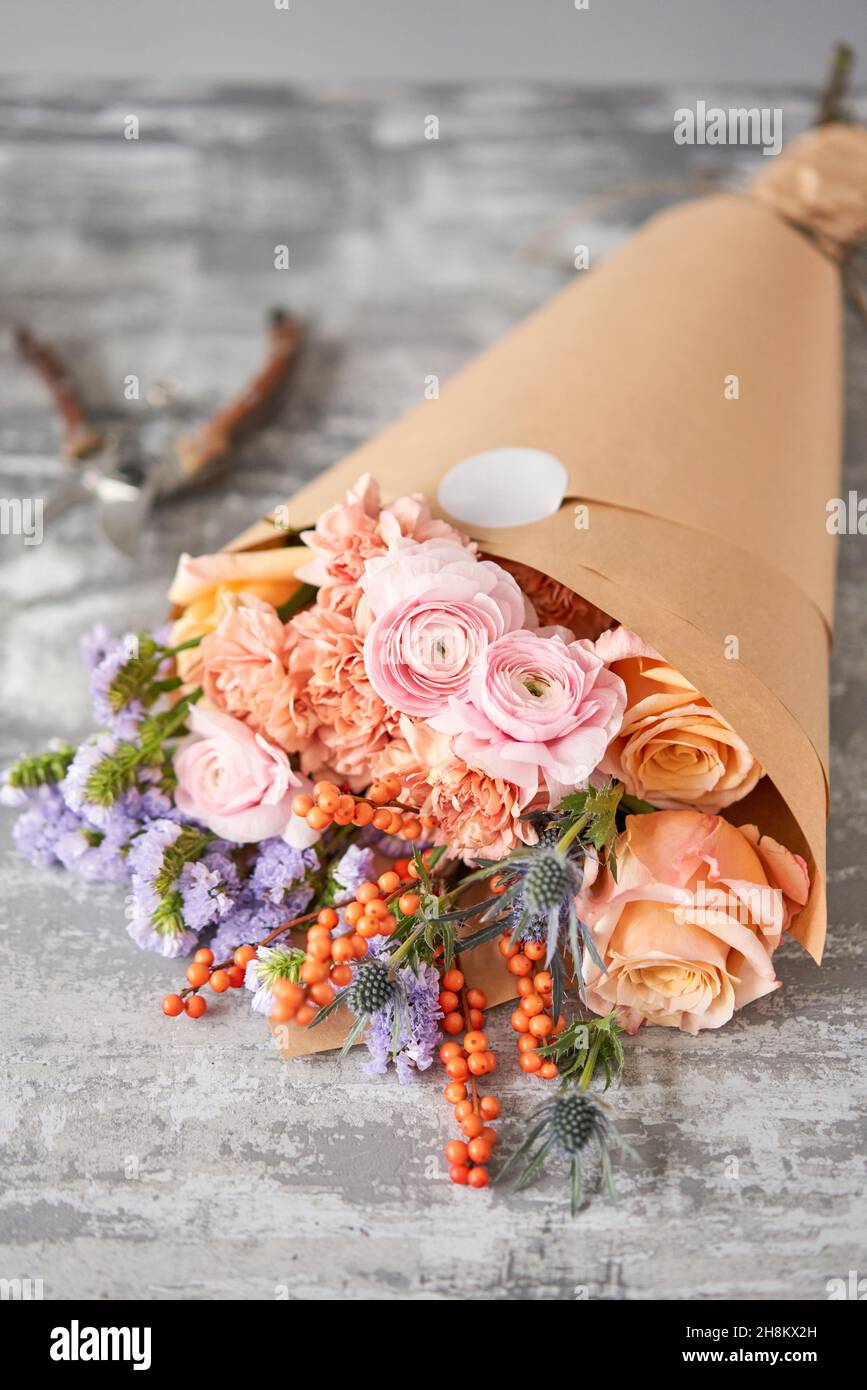 Step by step installation of flowers in a vase. Flowers bunch, set for home. Fresh cut flowers for decoration home. European floral shop. Delivery fre Stock Photo