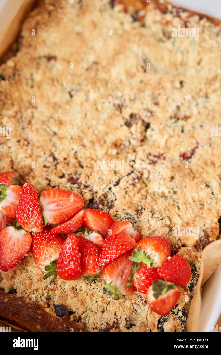 Apple pie bars with red berry jam, spices and crumble. Crumble cake Stock Photo