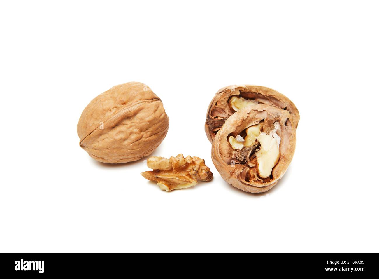 Walnuts whole and opened isolated on white background. Stock Photo