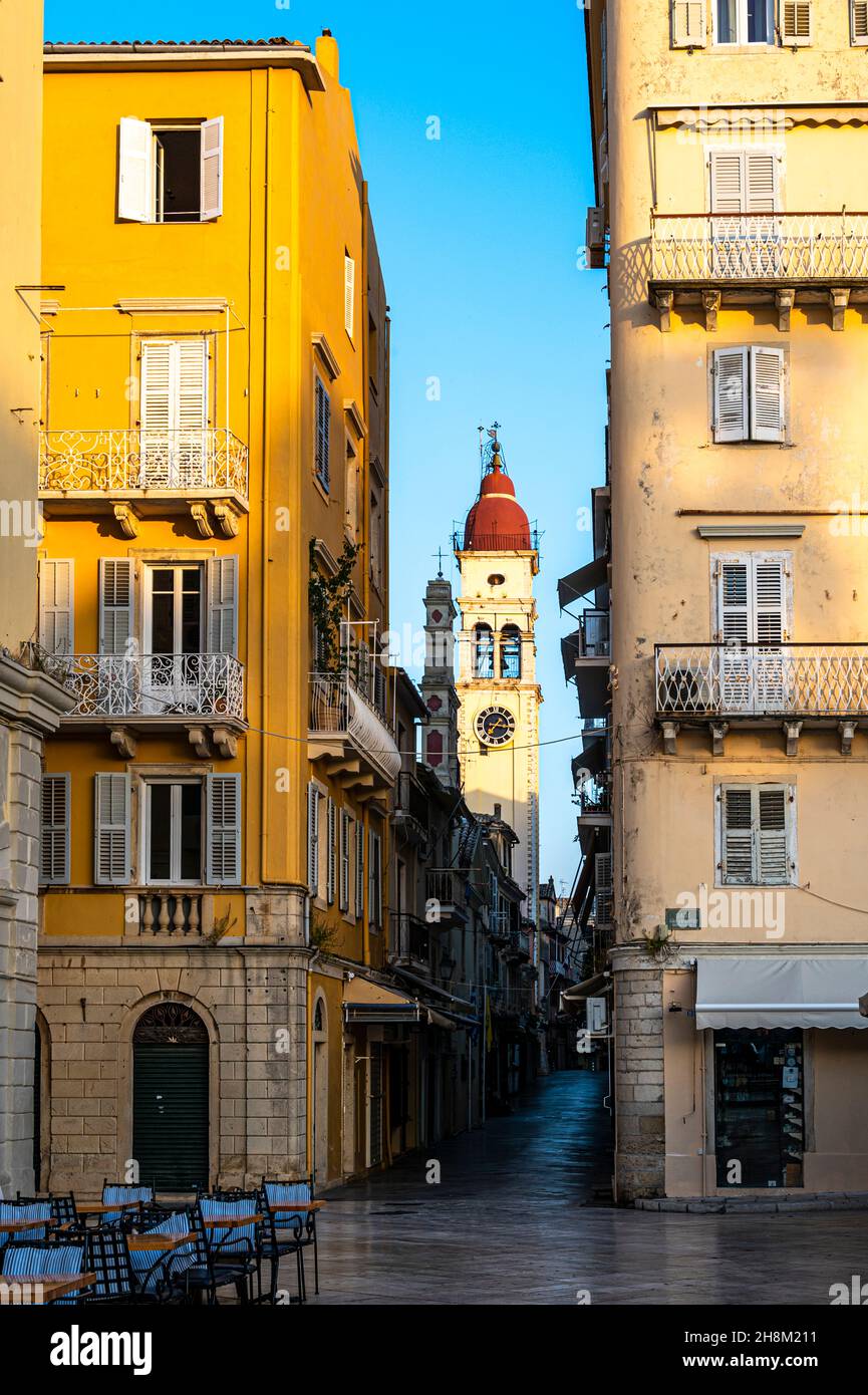 clock and bell tower of St Spyridon Church and street view of Old Town Corfu Stock Photo