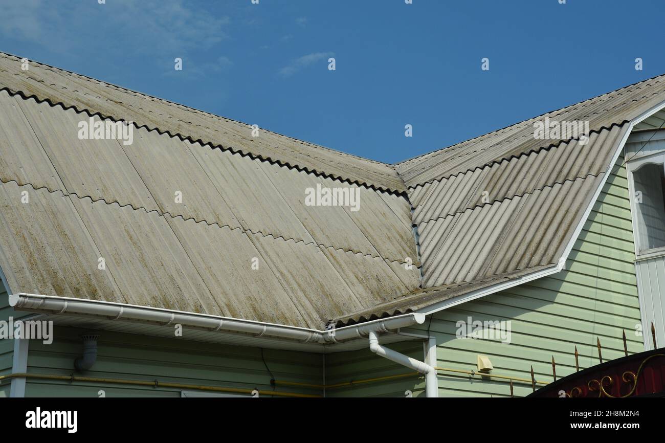 A closeup of a roof valley, roofing problem area of a mansard asbestos