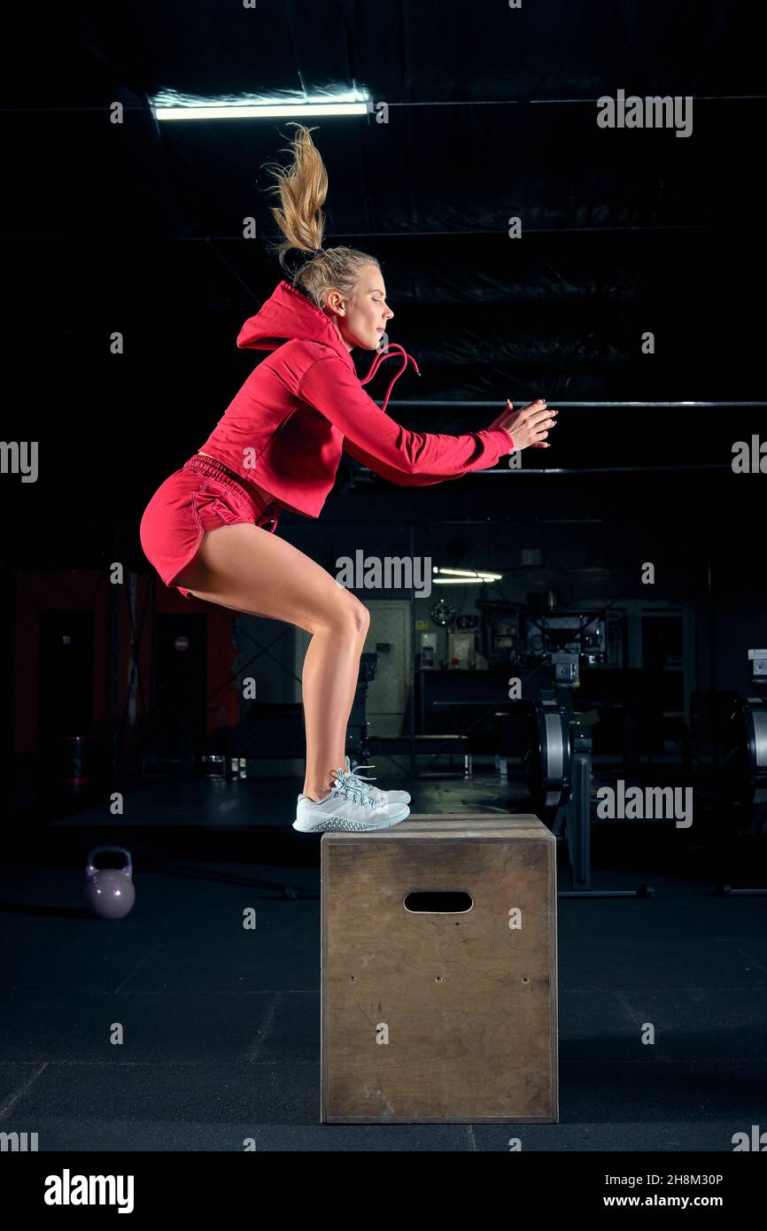 Female athlete is performing box jumps at gym Stock Photo Alamy
