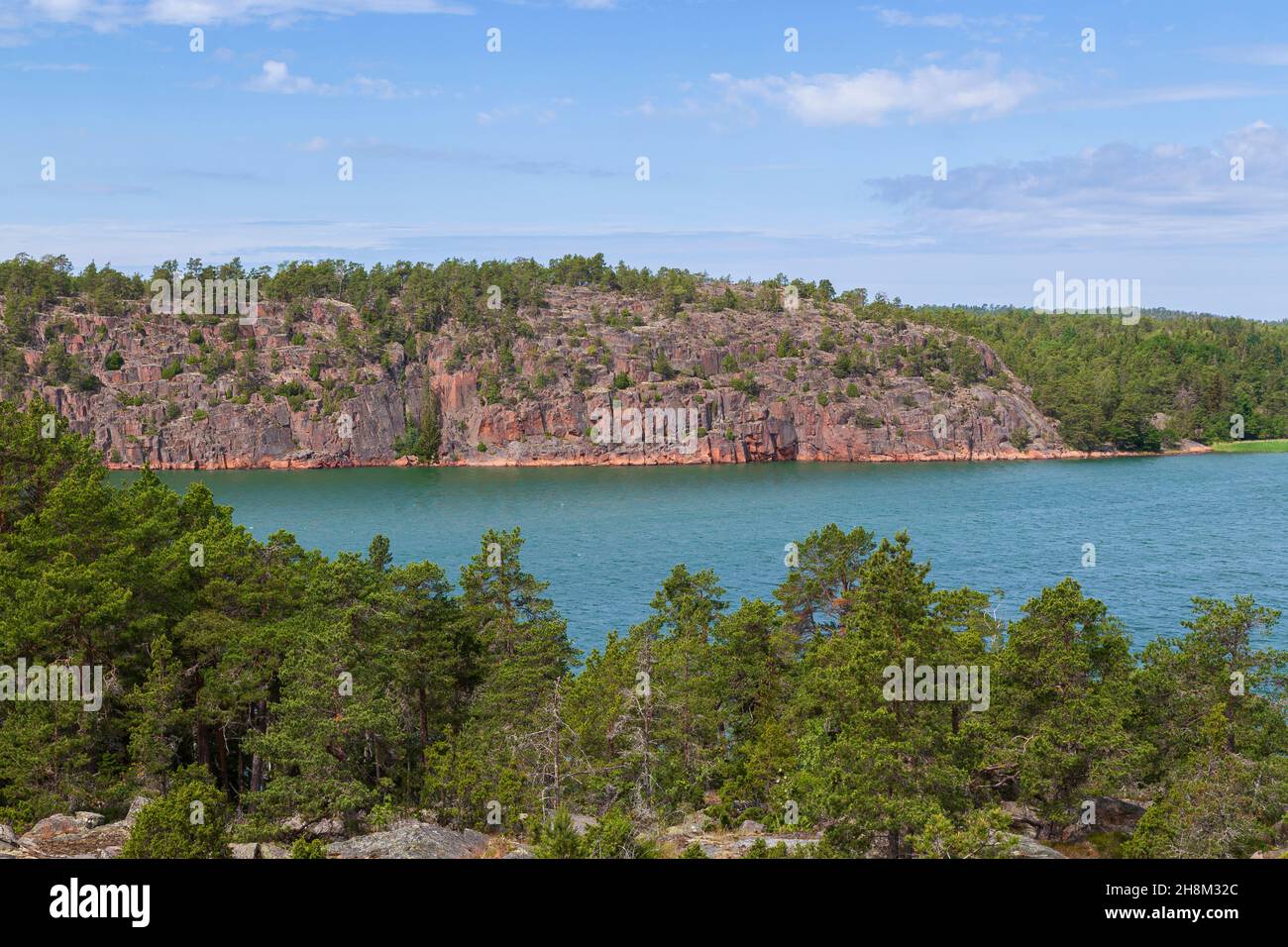 View of rocky and rugged coastline and sea in Åland Islands, Finland, on a sunny day in the summer. Stock Photo